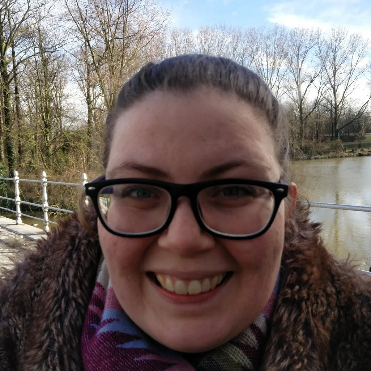 Ruth, the independent Speech and Language Therapist behind Chatty Sprouts in Marden, Kent, smiling by the river.